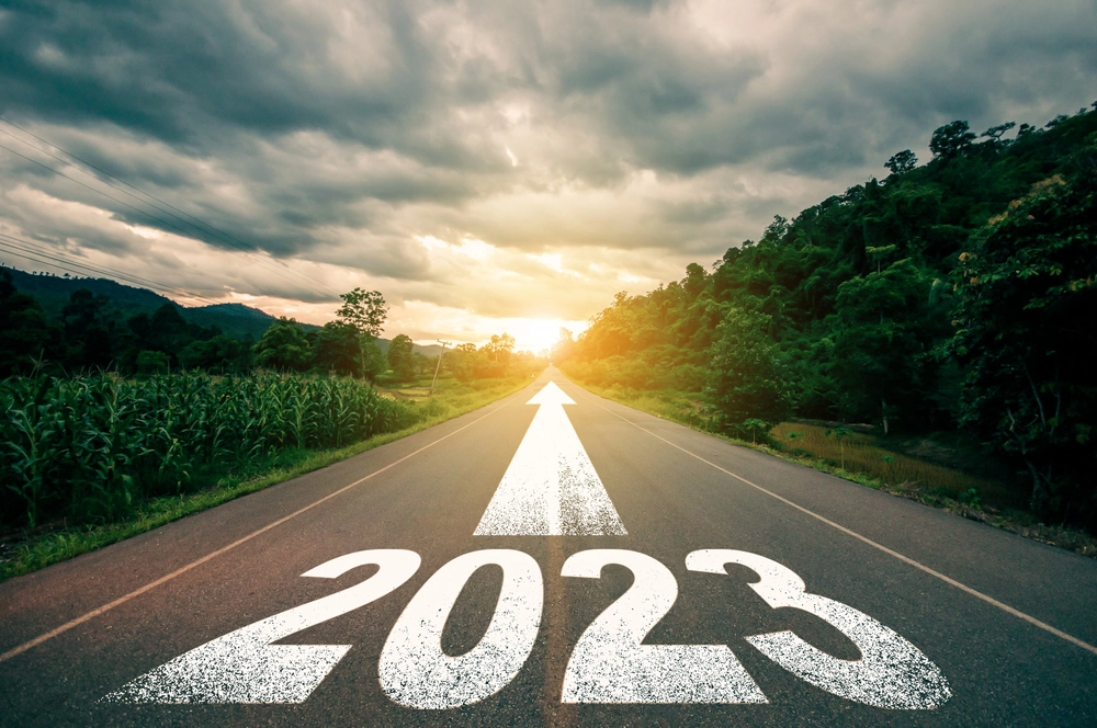 construction project manager | 2023 written on a road, arrow pointing forwards