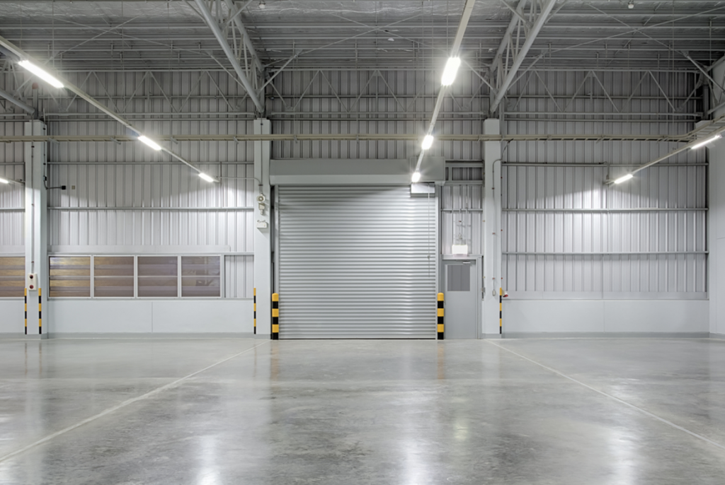 Refurbishment project | Empty warehouse space with grey floor and walls