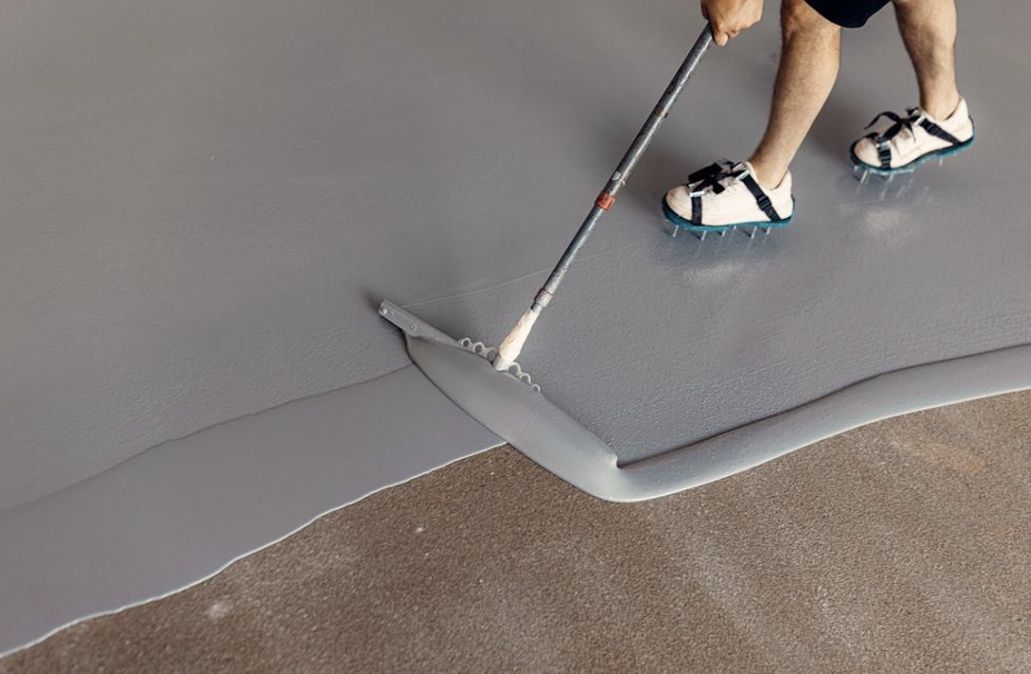 Resin floor | Person laying epoxy resin floor.