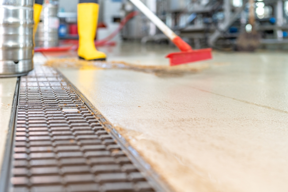 brewery floor drains in action being cleaned